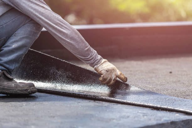 Professional Waterproofing technician working in Attica, NY